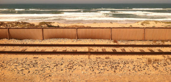 Train Tracks by a Beach